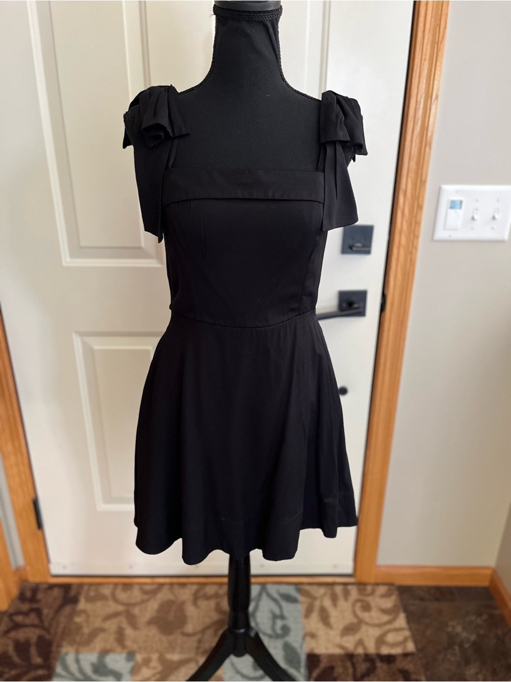 Women’s Trixxi black mini adjustable strap fit & flare lined dress. Size small